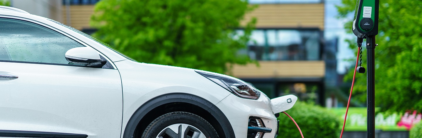 Kia Niro Electric Car Is Charging On Street Parking Lot