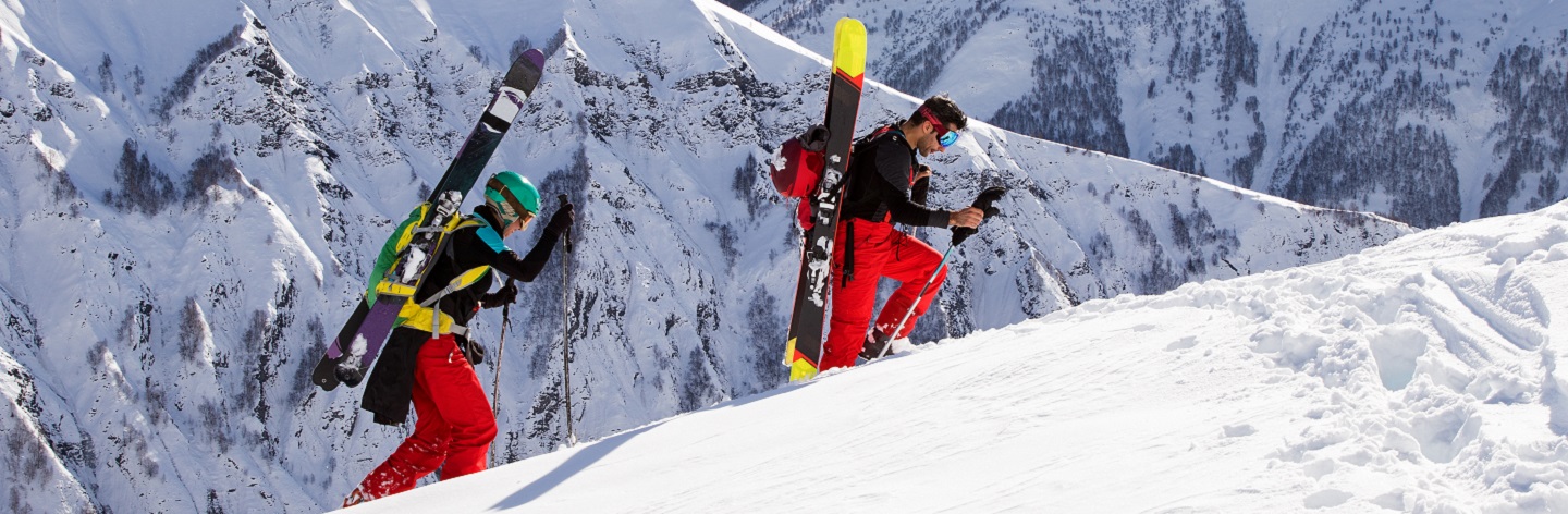Two Ski Mountaineers Climbing A Slope In The Heart Of The French Alps