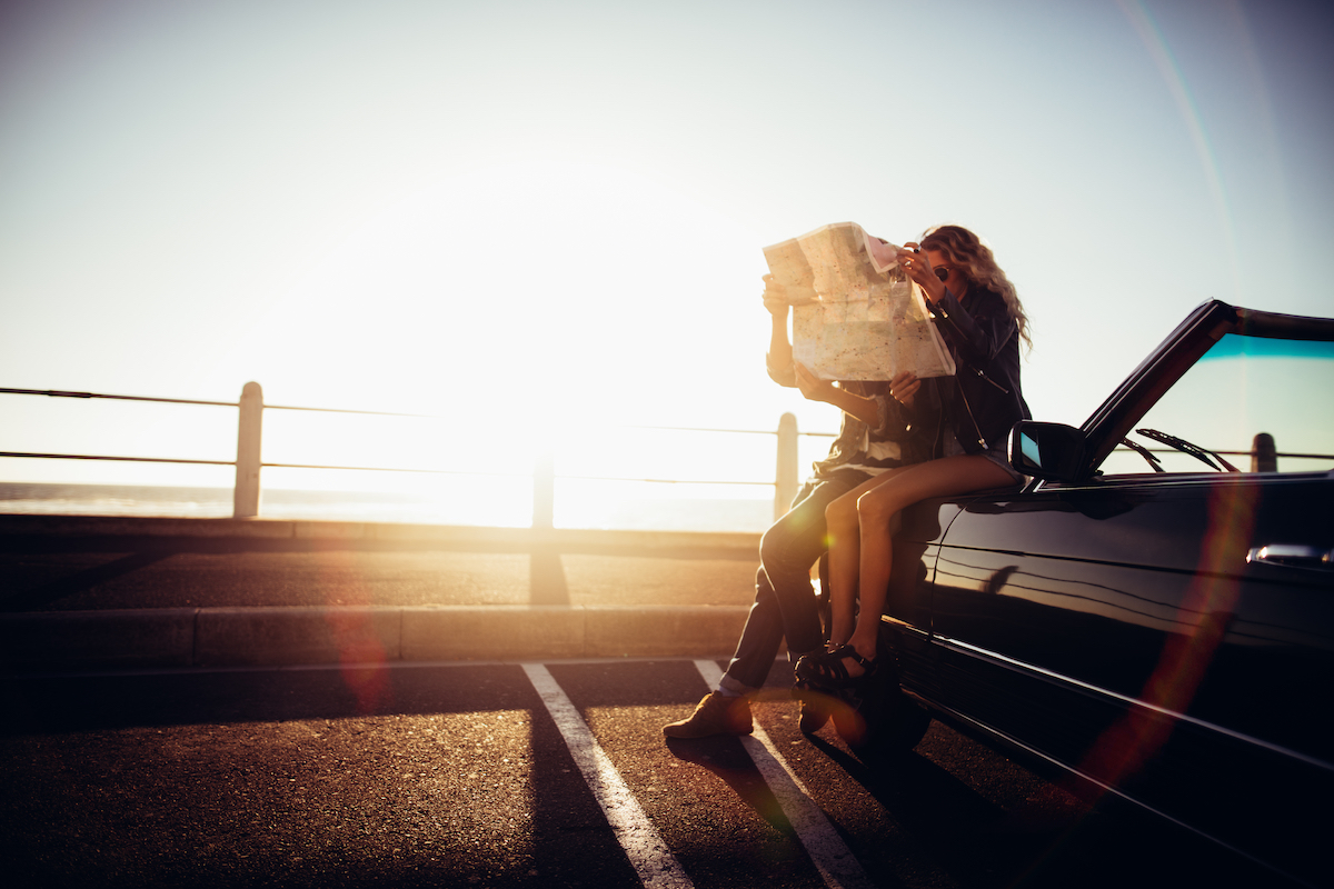 http://Hipster%20Couple%20Planning%20Their%20Summer%20Seaside%20Road%20Trip%20With%20Convertible