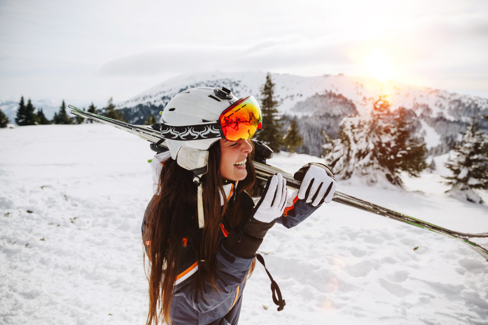 Portrait,of,beautiful,woman,with,ski,and,ski,suit,in